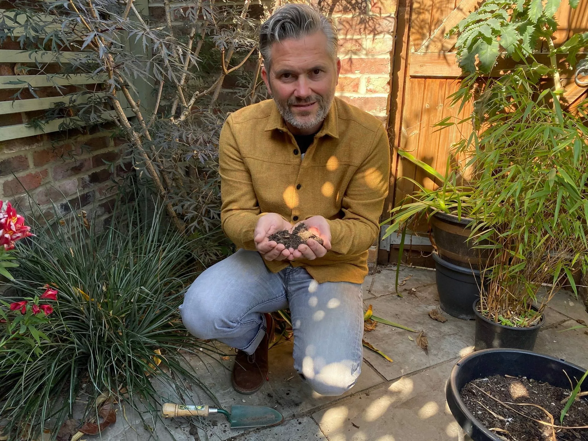 Martyn Cox with handful of soil