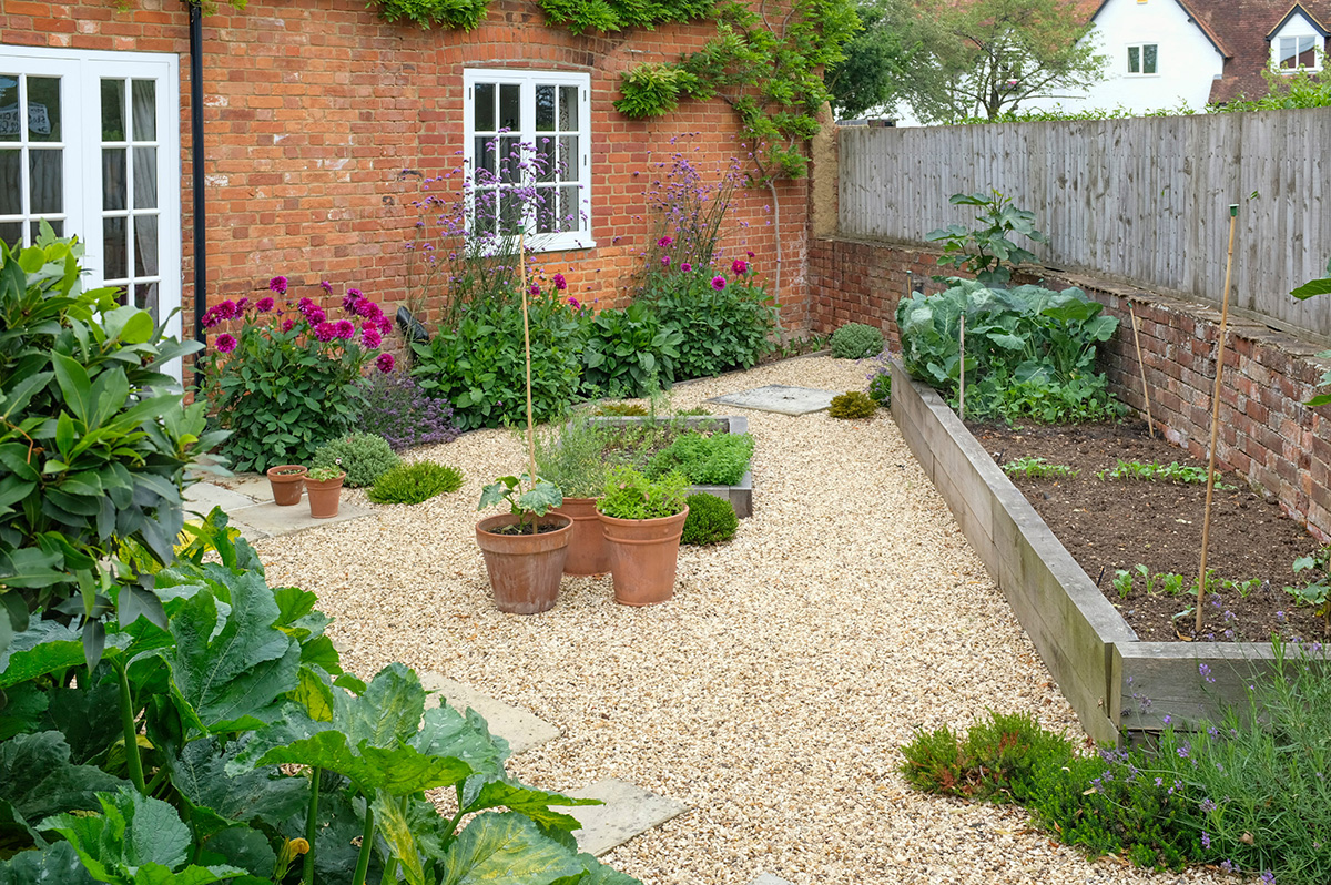 Gravelled area and vegetable beds close to house