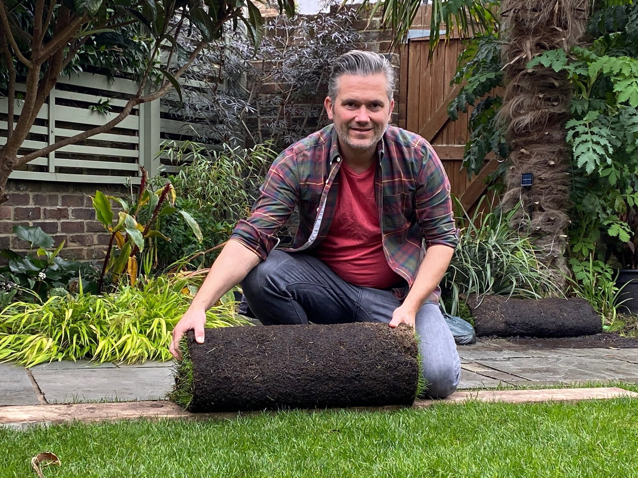 Martyn Cox with roll of turf