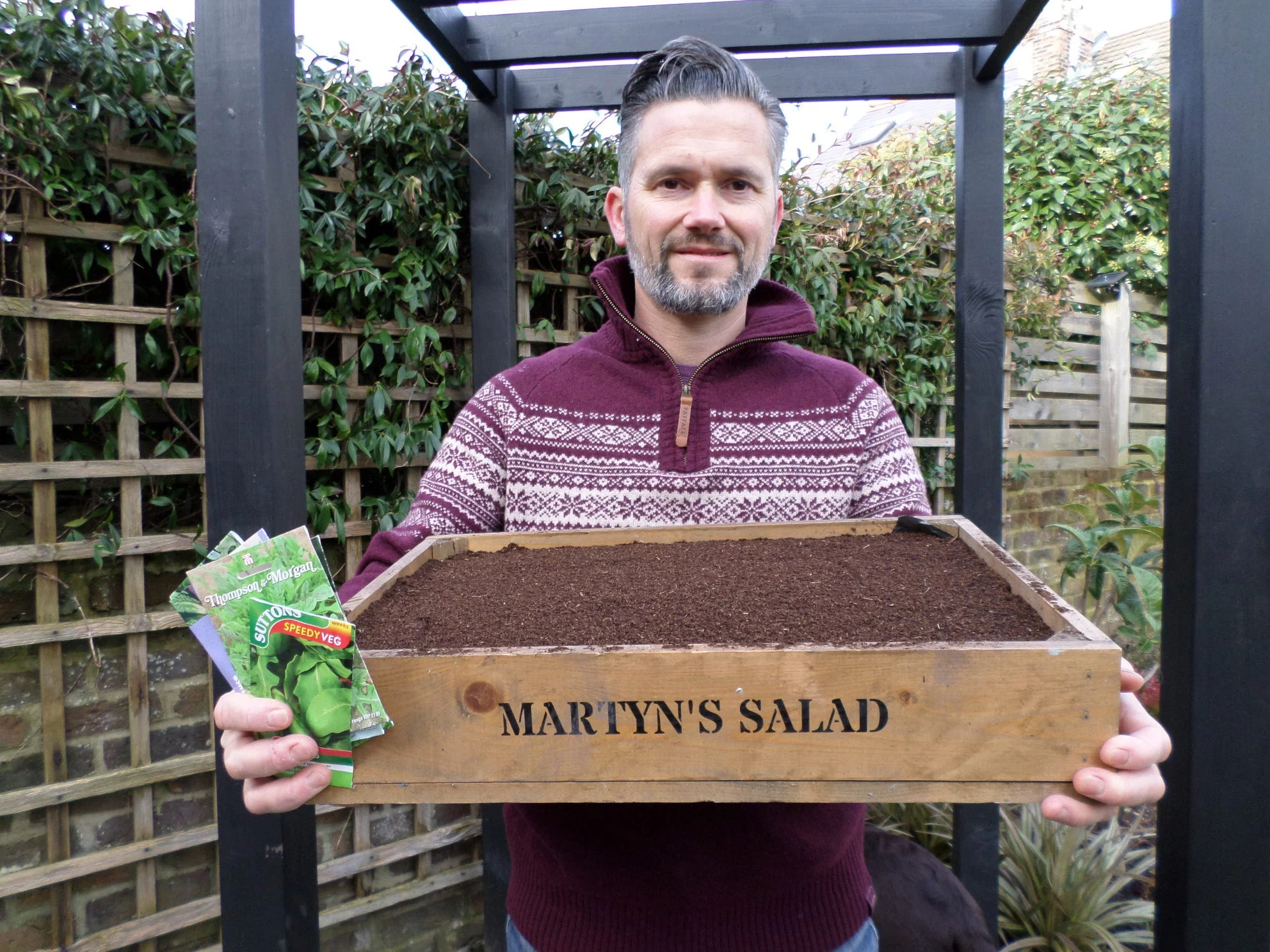 Martyn Cox with tray of seedlings