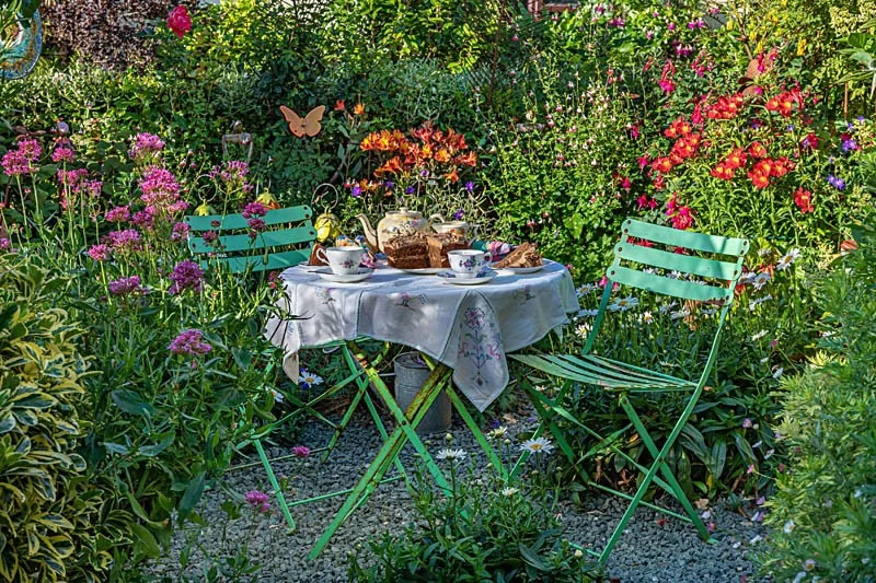 Green table and chairs at Driftwood Garden
