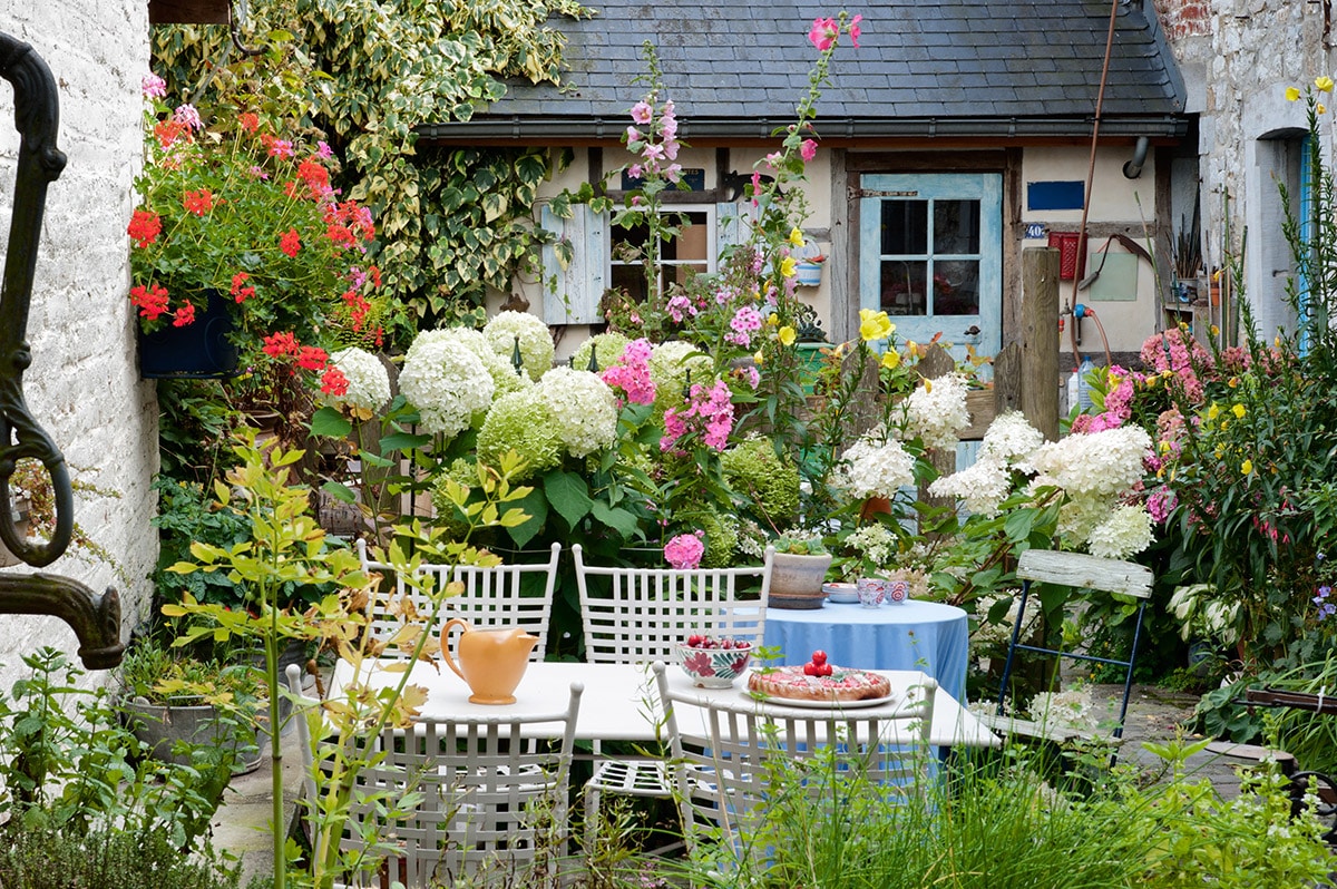 table and chairs in small courtyard garden