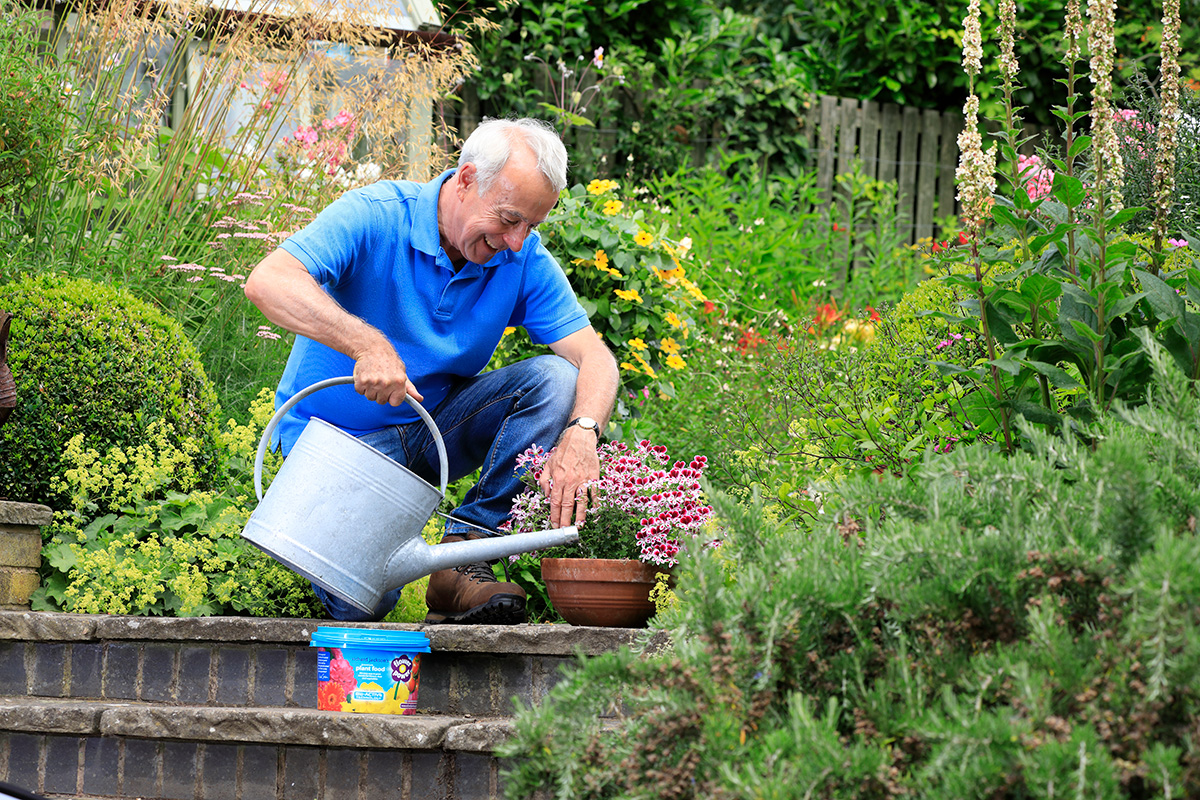 Richard feeding plant with Flower Power