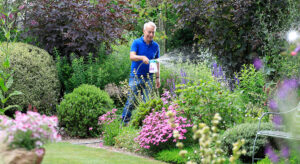Richard feeding plants using hose end sprayer