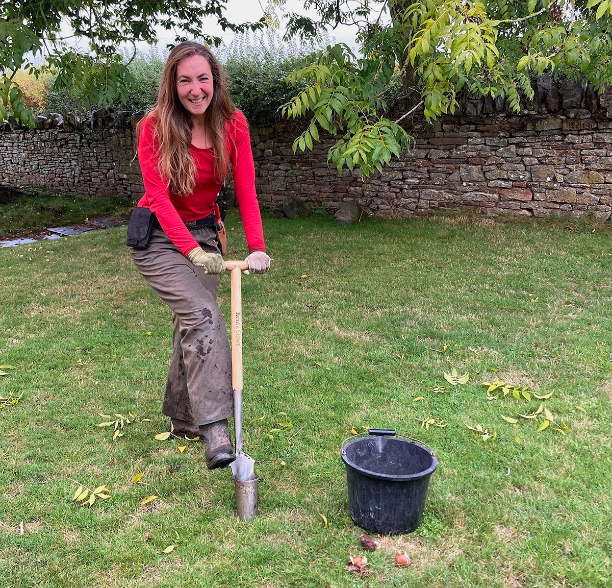 Debi Holland planting bulbs for naturalising in a lawn