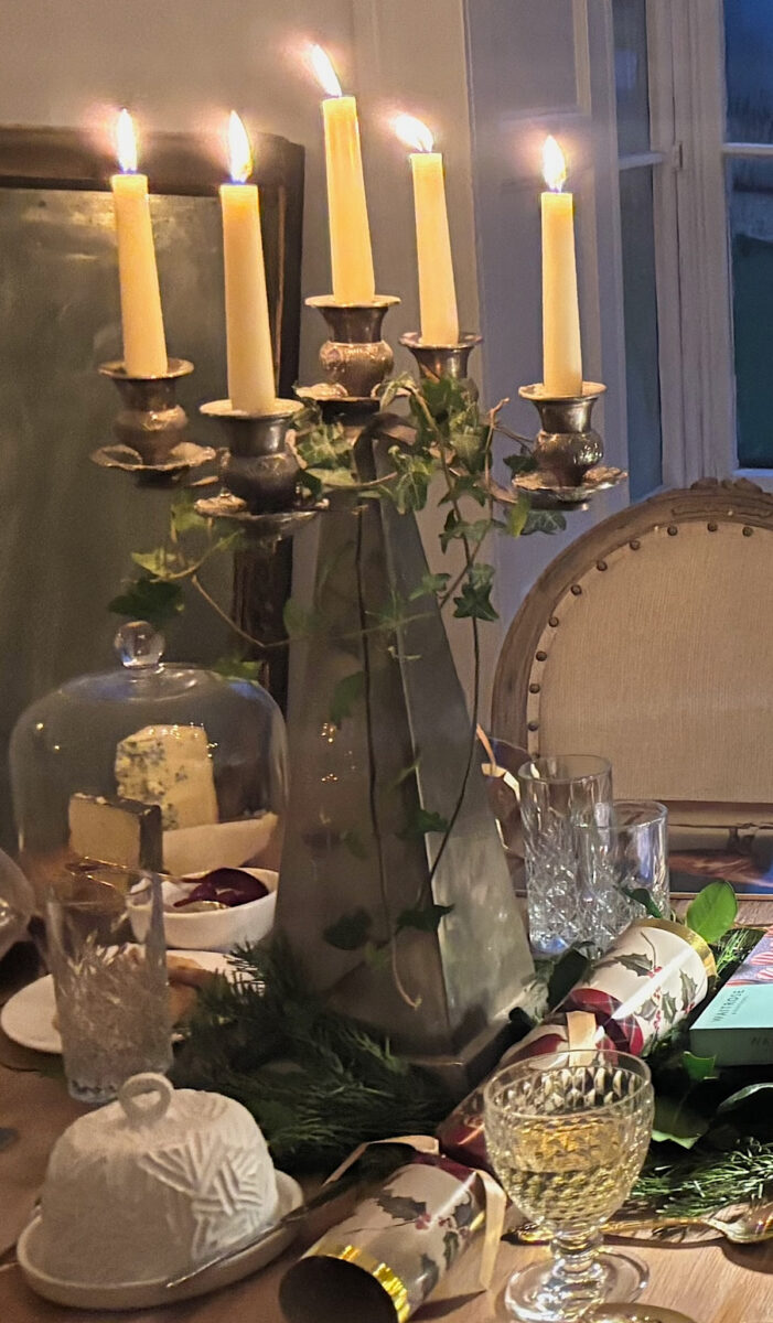 Ivy wrapped around candlestick on Christmas table