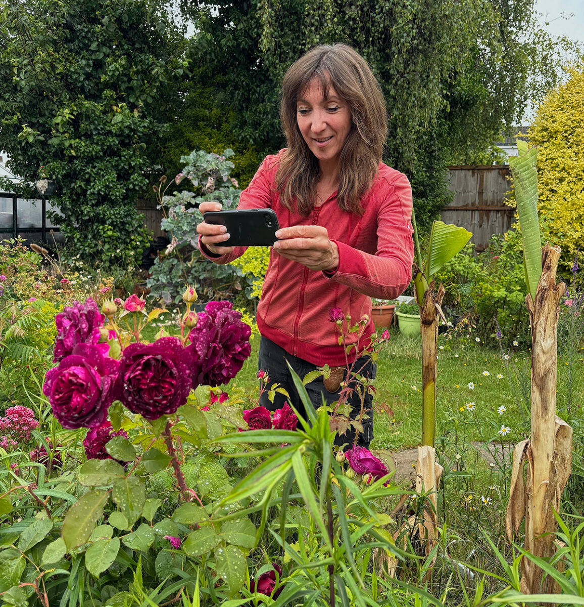 Debi taking photos of her garden plants