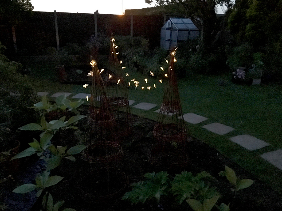 Fairy lights create a magical feel in the garden.